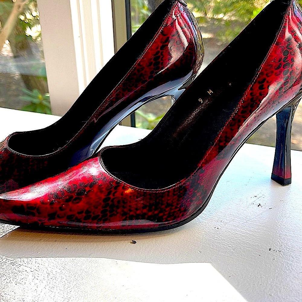 Melian patent leather red snakeskin pointy heels.